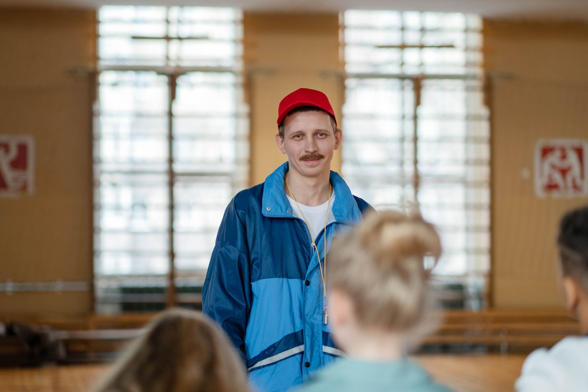 coach talking to teacher school