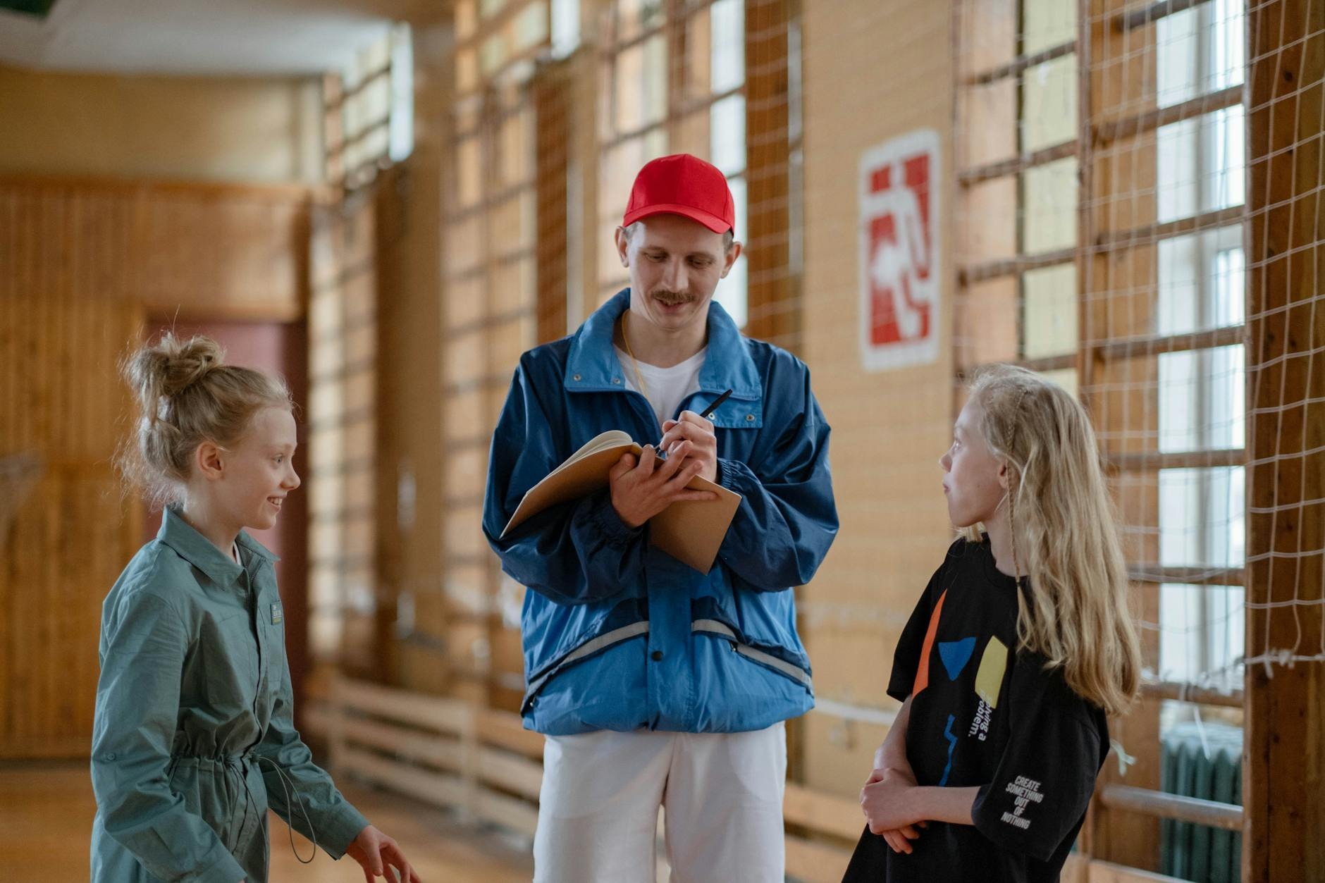 coach talking to teacher school